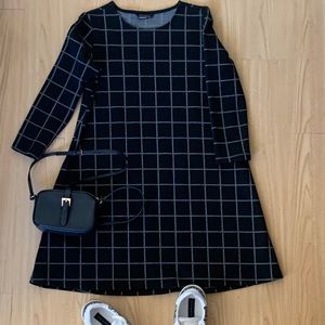 Mini black Stradivarius dress with white lines